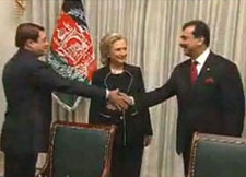 Afghan minister for commerce and trade Dr Anwar-ul-Haq Ahady shakes hands with Pakistan PM Yousaf Raza Gilani as Hillary Clinton looks on